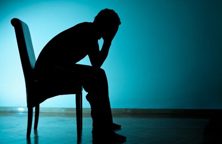 Una persona in preda alla depressione