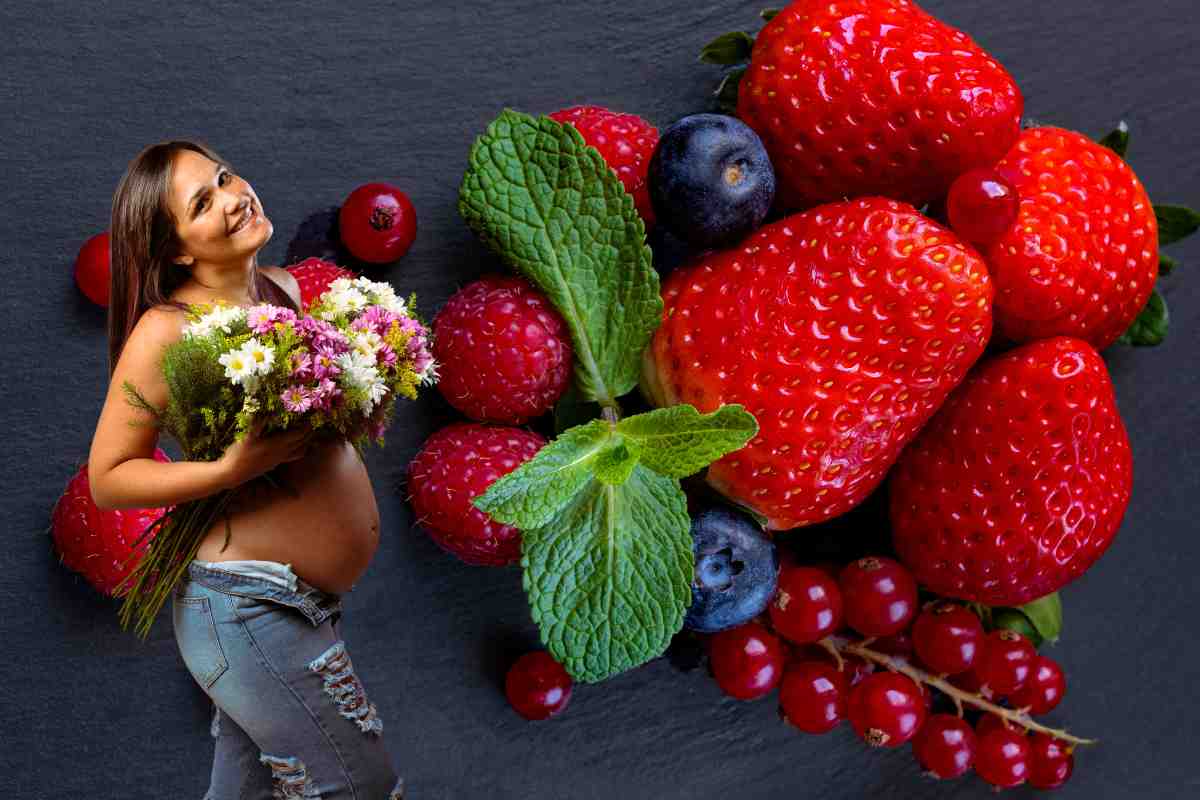 donna incinta e frutti rossi