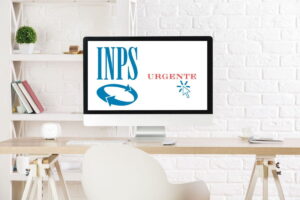 schermo pc su scrivania con logo inps e scritta urgente e cursore pc